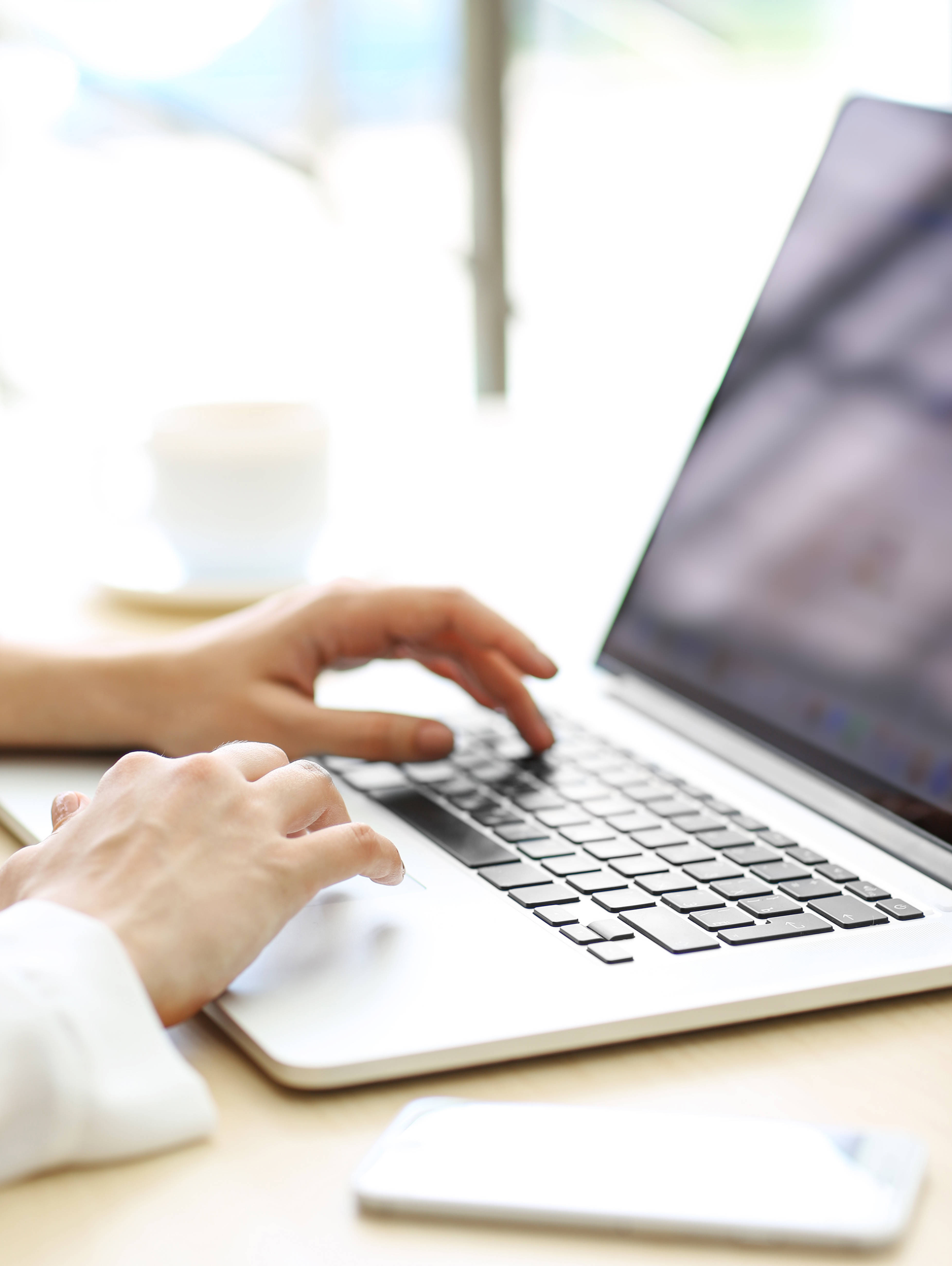 Woman typing on laptop