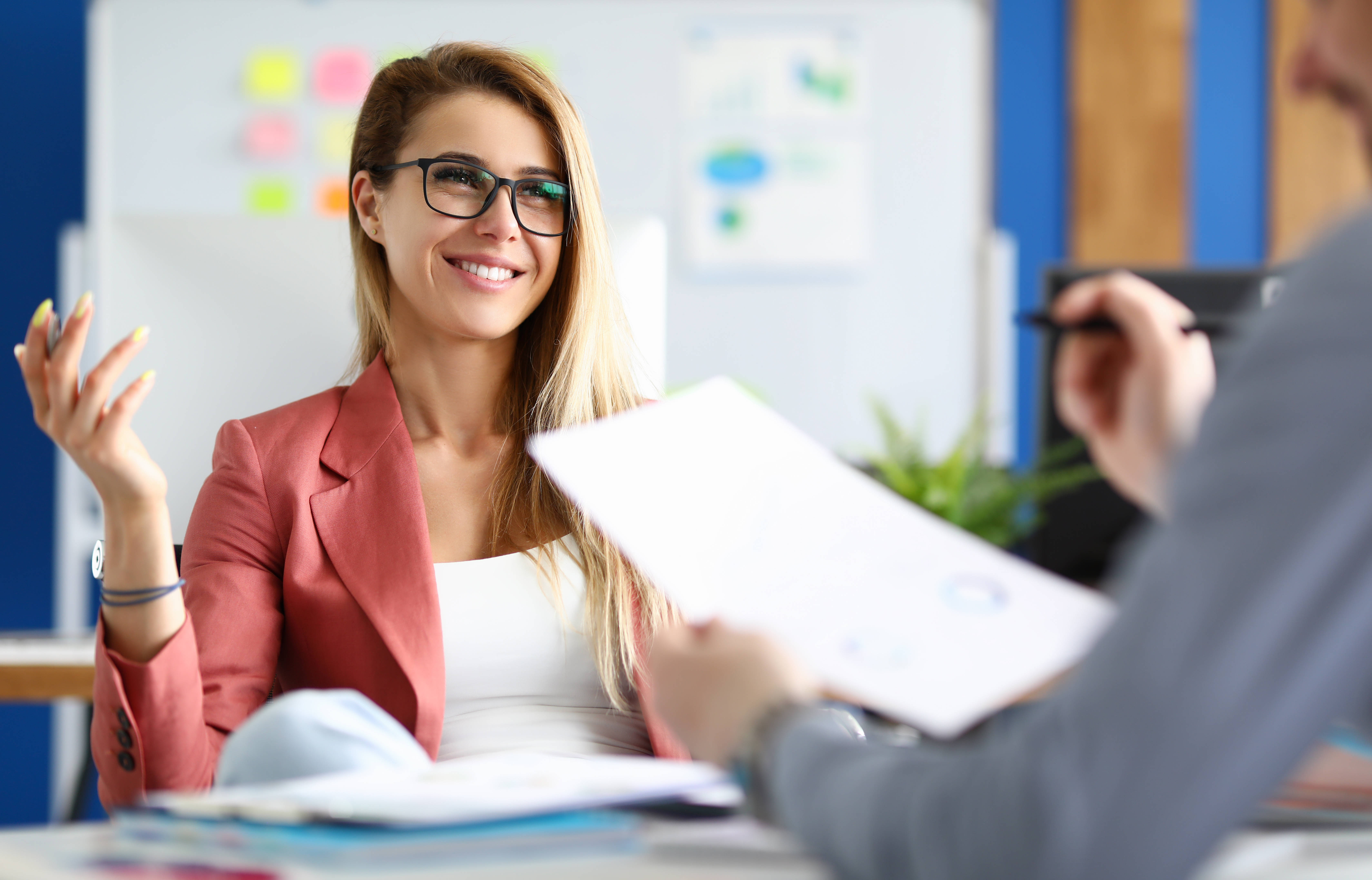 Two adult business people make work interview against office background