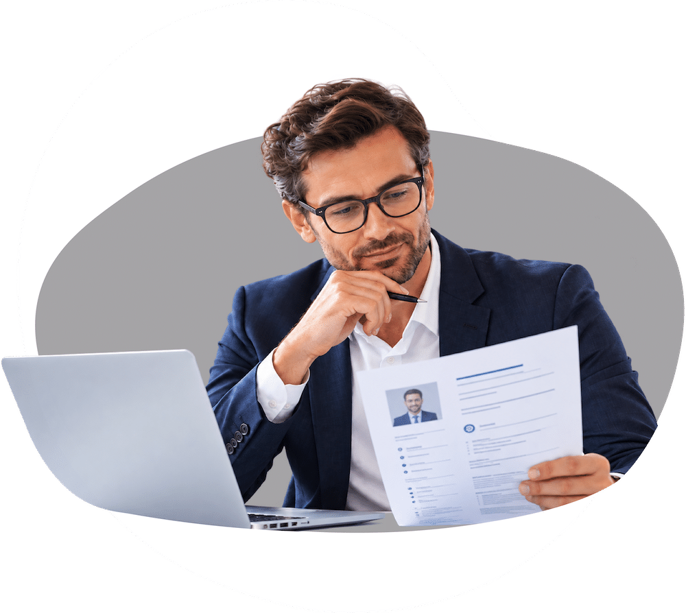 Recruitment professional reviewing a candidate CV during the screening process Recruitment professional reviewing a candidate CV during the screening process